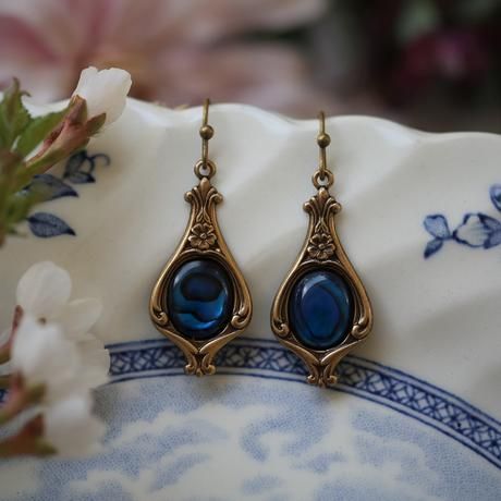 Brincos Boho dourados brilhantes com detalhe azul cintilante