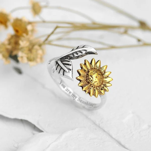 Anel de ouro elegante e flexível no desing radiante de girassol