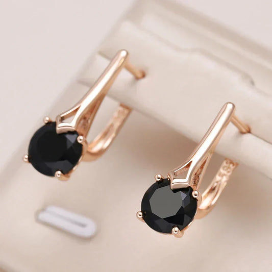 Brincos elegantes dourados com cristais pretos luxuosos