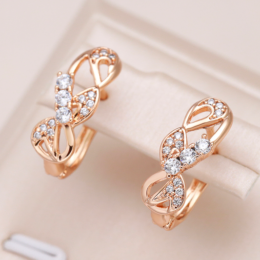 Brincos de cristal cintilantes com encantadora laço dourado