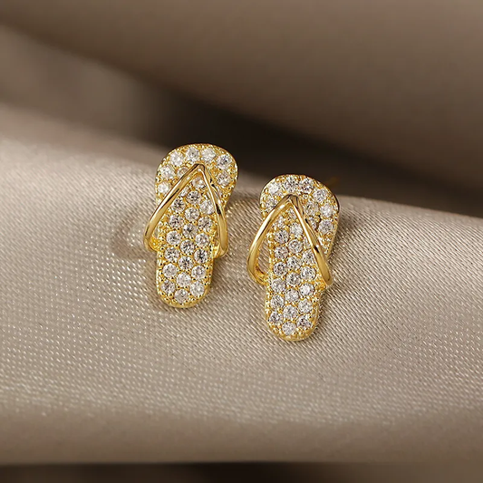 Brilhantes brincos de flip-flop em ouro com glitter para um toque radiante!