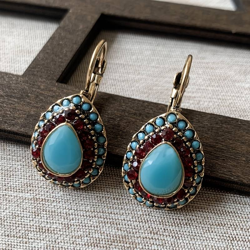 Lindos brincos vintage com design de mandala em opal azul